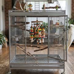 Large stainless steel cockatoo cage with foraging toys and a play stand attachment